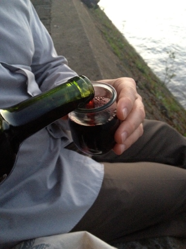 D pouring wine on the banks of the Seine